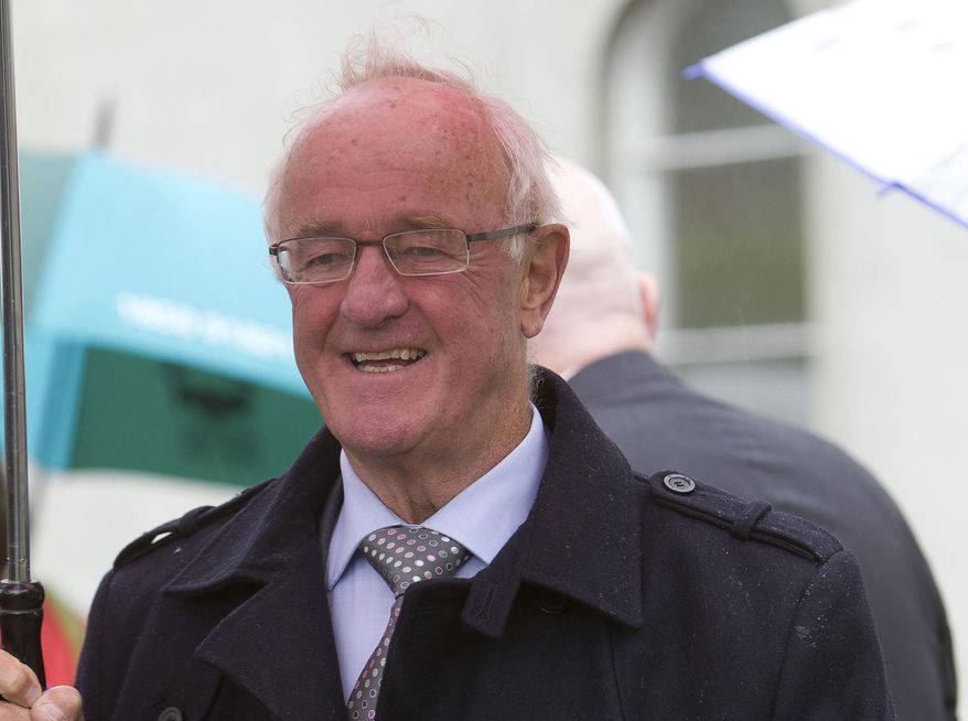 FILE - An Aug. 3, 2012 photo from files of actor Frank Kelly, walking in Dublin, Ireland. Kelly, best known for playing a foul-mouthed priest with a fondness for spouting the words “Feck! Drink! Girls!’’ in the series ‘Father Ted,’ has died at age 77. Ireland’s president Michael Higgins was among the many prominent Irish figures offering tributes to Kelly on Sunday, Feb. 28, 2016, describing it as a privilege to have him as a friend. (Liam McBurney/PA via AP) UNITED KINGDOM OUT