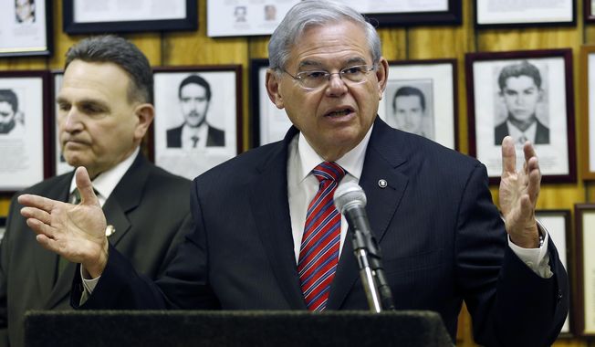 FILE - In this Feb. 18, 2016, file photo, U.S. Sen. Bob Menendez (D-NJ) speaks during a news conference, in Union City, N.J. A federal appeals court is to hear arguments in the corruption case of Menendez on Monday, Feb. 29. (AP Photo/Julio Cortez, File)