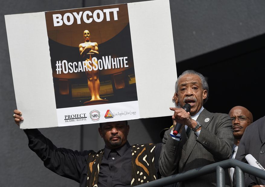Rev. Al Sharpton, right, and activist Najee Ali lead a rally prior to the Academy Awards ceremony, Sunday, Feb. 28, 2016, in the Hollywood section of Los Angeles in support of the nationwide tv tune-out protesting the lack of diversity in Hollywood. (AP Photo/Mark J. Terrill)