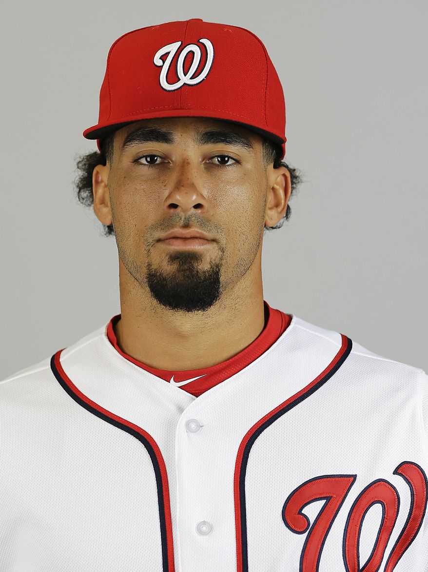 File-This is a 2015 file photo of Ian Desmond of the Washington Nationals baseball team. A baseball official with knowledge of the deal says free agent Desmond has agreed to a one-year deal with the Texas Rangers. The person spoke to The Associated Press on Sunday, Feb. 28, 2016, on the condition of anonymity because the deal, first reported by Fox Sports, is subject to the former Washington Nationals shortstop passing a physical. (AP Photo/David Goldman, File)