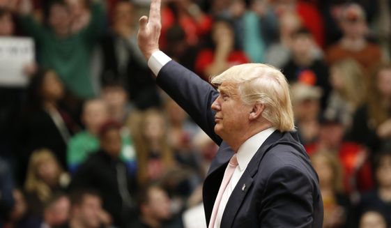 Republican presidential candidate, Donald Trump waves to the crowd during a rally at Radford University in Radford, Va., Monday, Feb. 29, 2016. (AP Photo/Steve Helber)