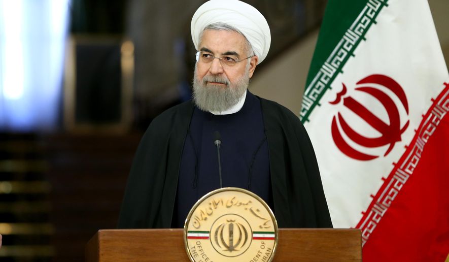 Iranian President Hassan Rouhani speaks with media in a joint press conference with Swiss President Johann Schneider after their meeting at the Saadabad Palace in Tehran, Iran, Saturday, Feb. 27, 2016. A 40-member economic and trade delegation is accompanying Schneider on his Iran trip, the first visit by a Swiss president after Iran’s Islamic Revolution 37 years ago. (AP Photo/Ebrahim Noroozi)
