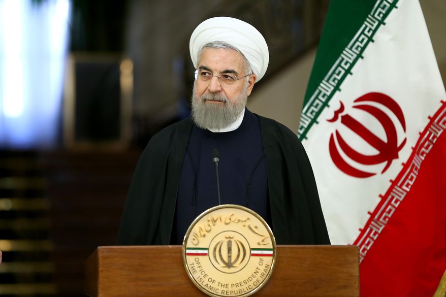 Iranian President Hassan Rouhani speaks with media in a joint press conference with Swiss President Johann Schneider after their meeting at the Saadabad Palace in Tehran, Iran, Saturday, Feb. 27, 2016. A 40-member economic and trade delegation is accompanying Schneider on his Iran trip, the first visit by a Swiss president after Iran’s Islamic Revolution 37 years ago. (AP Photo/Ebrahim Noroozi)