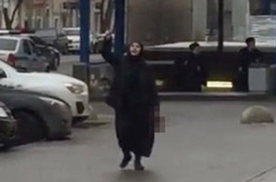 Russian police arrested a woman brandishing a child's severed head and threatening to activate a bomb outside a Moscow subway station on Monday, officials said. (YouTube via New York Post)