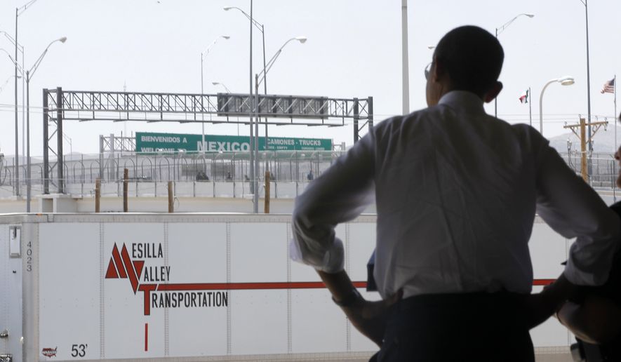 President Obama looks toward Mexico as he tours the Bridge of America Cargo Facility in El Paso, Texas, on May 10, 2011, as he visited the U.S.-Mexico border to speak about immigration reform. (Associated Press) **FILE**