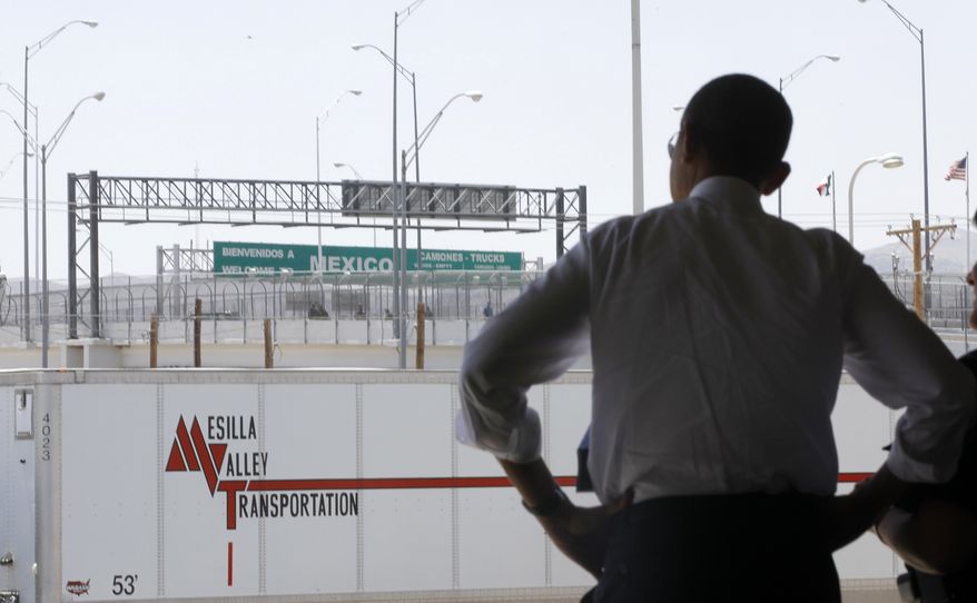 President Obama looks toward Mexico as he tours the Bridge of America Cargo Facility in El Paso, Texas, on May 10, 2011, as he visited the U.S.-Mexico border to speak about immigration reform. (Associated Press) **FILE**