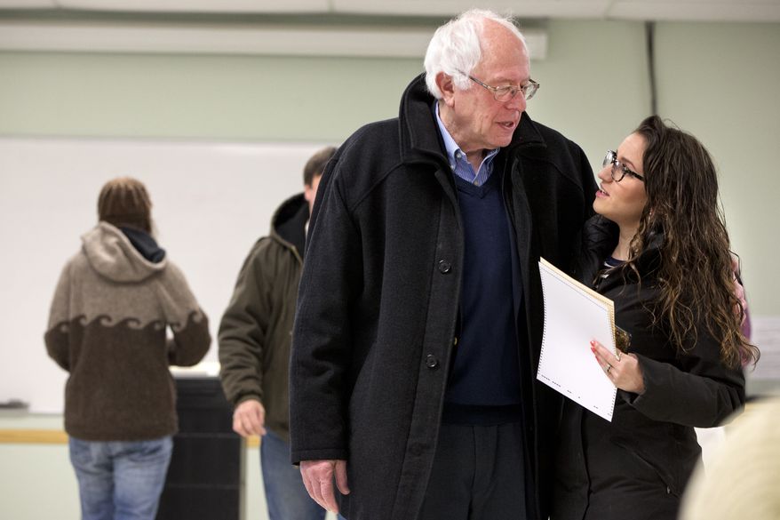 Democratic presidential candidate Sen. Bernie Sanders, I-Vt., is hugged by a voter after voting in the Vermont primary at the Robert Miller Community and Recreation Center in Burlington, Vermont, Tuesday, March 1, 2016, on Super Tuesday. (AP Photo/Jacquelyn Martin)???