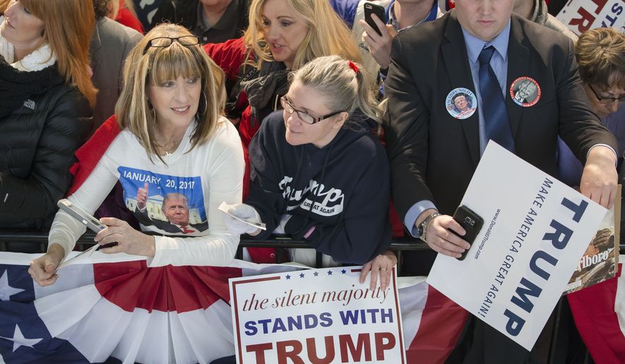 Attendees wait for Republican presidential candidate Donald Trump to greet them during a campaign stop at the Signature Flight Hangar at Port-Columbus International Airport, Tuesday, March 1, 2016, in Columbus, Ohio. (AP Photo/John Minchillo)