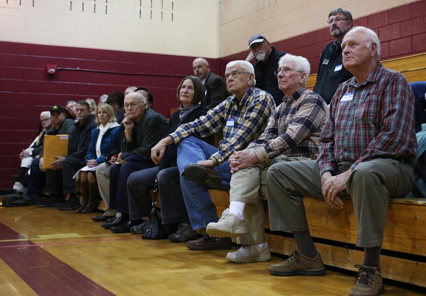 File- In this Tuesday, March 3, 2014, file photo, caucus members listen to a speech by then-Republican gubernatorial candidate Bob Beauprez during the District II Republican caucus held at Angevine Middle School in Lafayette, Colo. Republicans and Democrats alike are preparing for low-key caucuses on Tuesday--even though the presidential seat is open and the caucuses are taking place on Super Tuesday, the biggest single-day delegate haul of the nimination contests. (AP Photo/David Zalubowski, File)