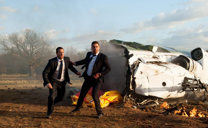 This image released by Focus Features shows Aaron Eckhart, left, and Gerard Butler in a scene from Grammercy Pictures', "London Has Fallen." (David Appleby/Grammercy Pictures/Focus Features via AP)