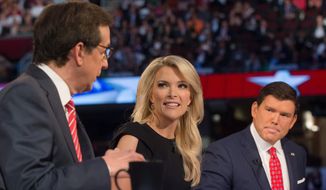 FOX News moderators Megyn Kelly, center, and Bret Baier, right, listens as Chris Wallace, left, beings introductions during the first Republican presidential debate in Cleveland, in this Aug. 6, 2015, file photo. (AP Photo/John Minchillo, File)