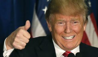 Republican presidential candidate Donald Trump gives a thumbs-up as he speaks at campaign stop, Thursday, March 3, 2016, in Portland, Maine. (AP Photo/Robert F. Bukaty)
