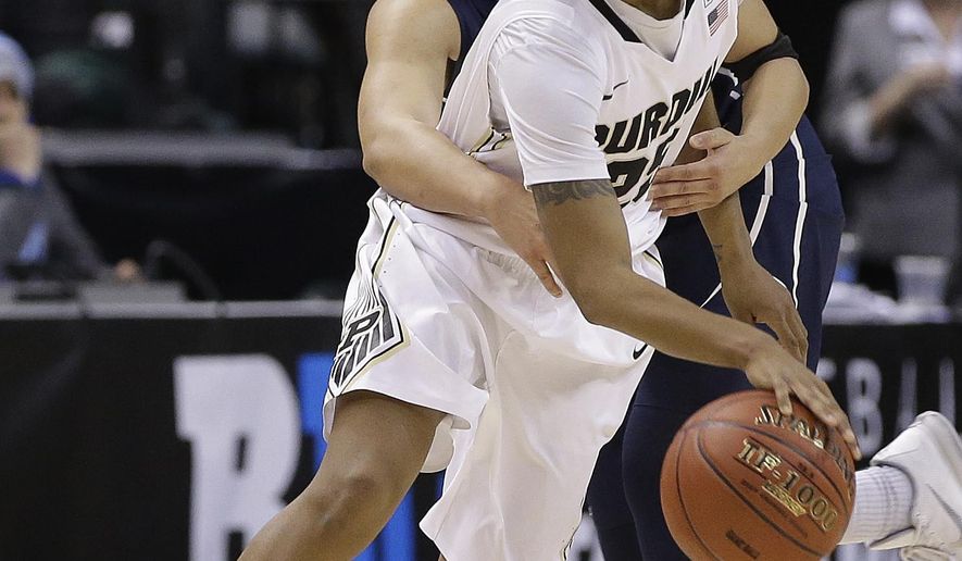 Purdue&#39;s April Wilson (25) is fouled by Penn State&#39;s Lindsey Spann (12) during the second half of an NCAA college basketball game at the Big Ten women&#39;s tournament Thursday, March 3, 2016, in Indianapolis. (AP Photo/Darron Cummings)