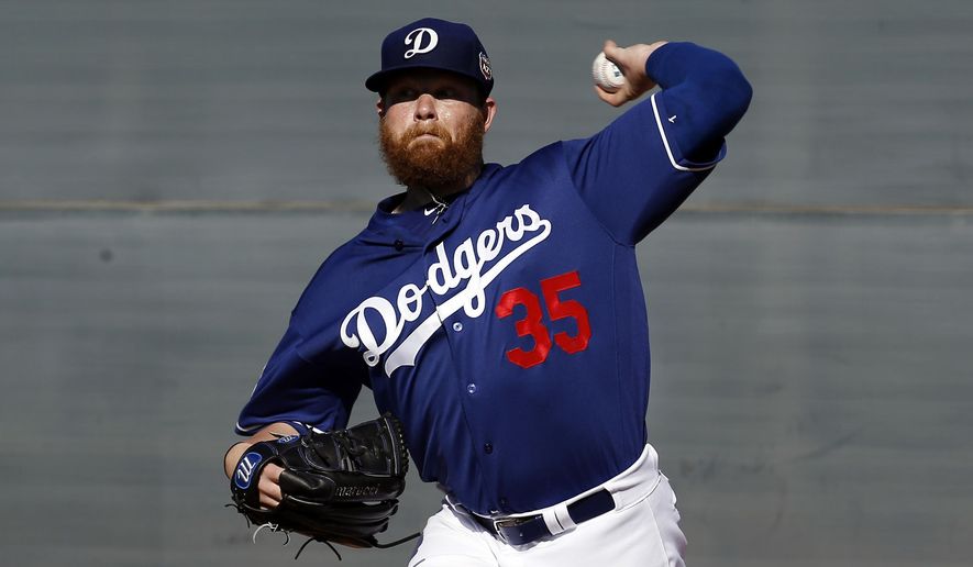 FILE - In this Feb. 20, 2016, file photo, Los Angeles Dodgers&#39; Brett Anderson throws during a spring training baseball workout, in Glendale, Ariz. Anderson has a bulging disk in his lower back and was scheduled for an operation Thursday, March 3, 2016, at a Phoenix hospital, Dodgers manager Dave Roberts said.(AP Photo/Morry Gash, File)