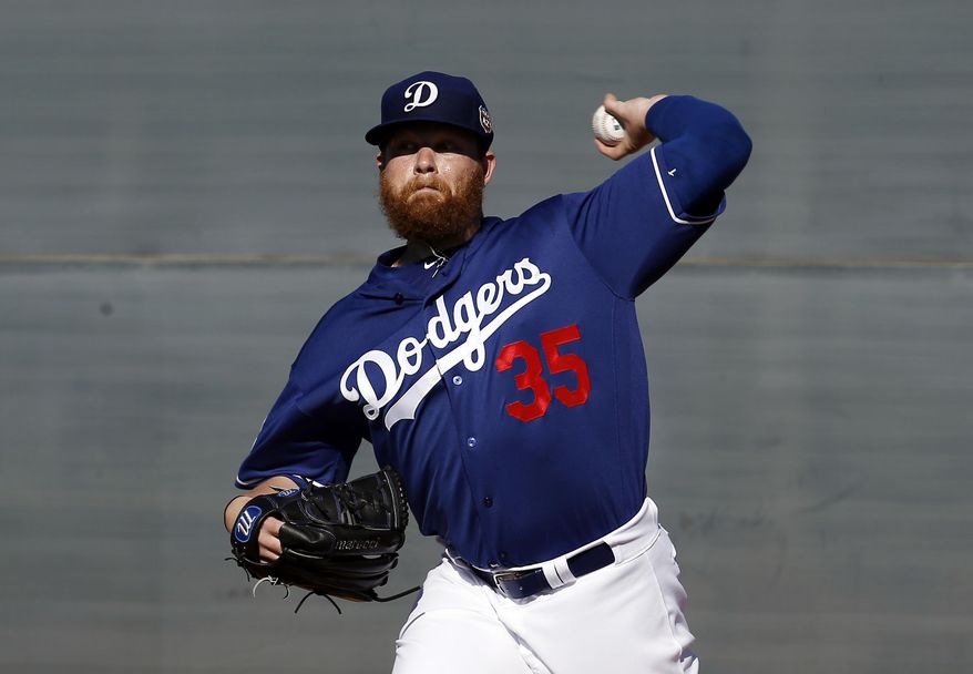FILE - In this Feb. 20, 2016, file photo, Los Angeles Dodgers&#39; Brett Anderson throws during a spring training baseball workout, in Glendale, Ariz. Anderson has a bulging disk in his lower back and was scheduled for an operation Thursday, March 3, 2016, at a Phoenix hospital, Dodgers manager Dave Roberts said.(AP Photo/Morry Gash, File)