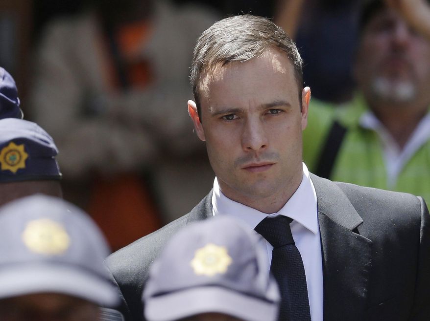 FILE - In this Friday, Oct. 17, 2014 file photo, Oscar Pistorius is escorted by police officers as he leaves the high court in Pretoria, South Africa. A lawyer for Oscar Pistorius says South Africa's highest court has dismissed the former track star's appeal of his murder conviction. The ruling by the Constitutional Court on Thursday March 3, 2016 clears the way for a judge to sentence Pistorius for murder at a hearing scheduled for April 18. (AP Photo/Themba Hadebe, File)