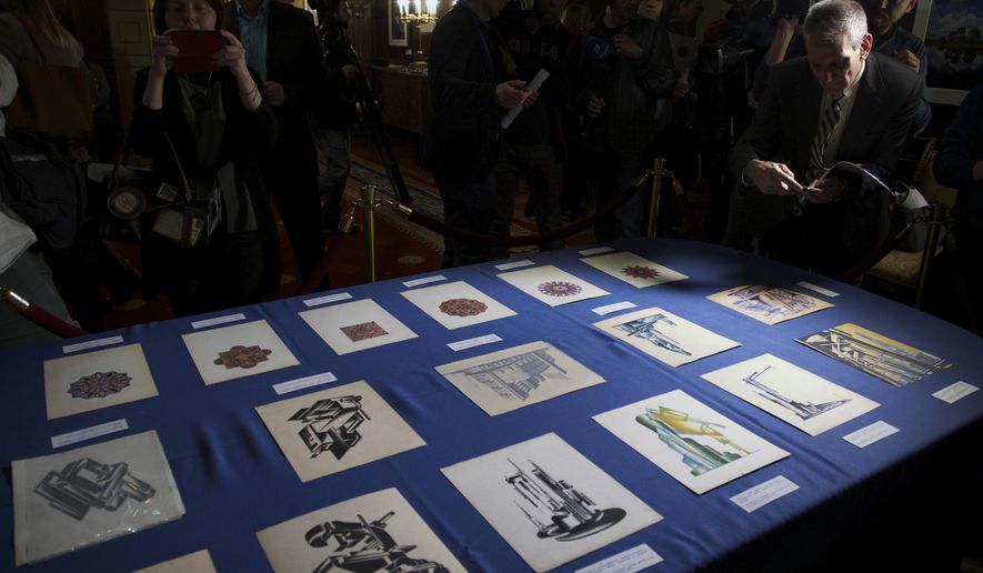 Documents returned to Russia are on display during a ceremony at the U.S. ambassador's residence in Moscow, Russia, Thursday, March 3, 2016. The U.S. has returned 28 documents from the 18th and 19th centuries to the Russian government. During a ceremony at the ambassador's residence, a branch of the U.S. Homeland Security Department repatriated the documents ranging from imperial decrees to architectural drawings that were stolen and recently recovered in the United States. (AP Photo/Ivan Sekretarev)