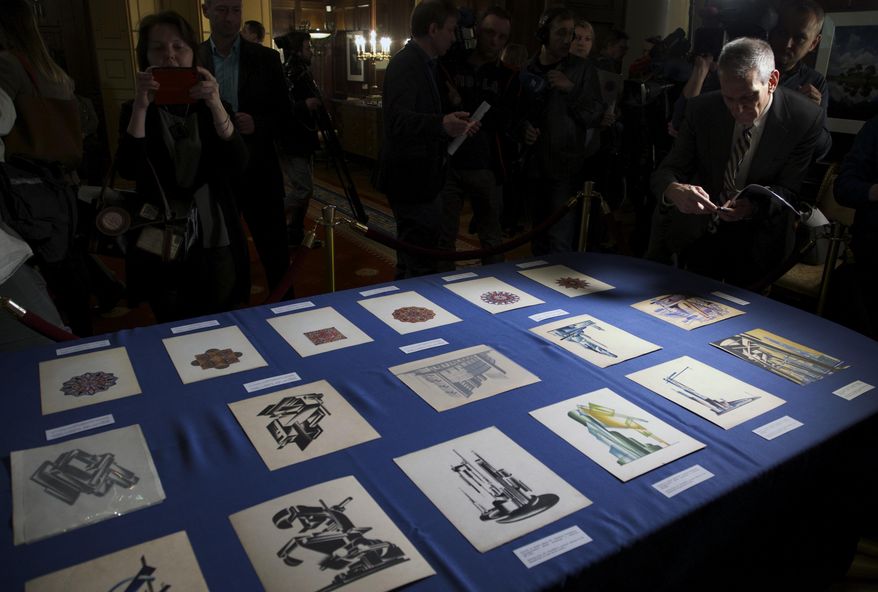 Documents returned to Russia are on display during a ceremony at the U.S. ambassador's residence in Moscow, Russia, Thursday, March 3, 2016. The U.S. has returned 28 documents from the 18th and 19th centuries to the Russian government. During a ceremony at the ambassador's residence, a branch of the U.S. Homeland Security Department repatriated the documents ranging from imperial decrees to architectural drawings that were stolen and recently recovered in the United States. (AP Photo/Ivan Sekretarev)