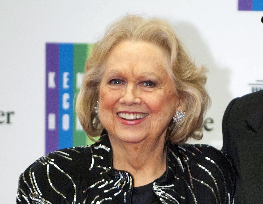 FILE - In this Dec. 7, 2013 file photo, Barbara Cook arrives at the State Department for the Kennedy Center Honors gala dinner in Washington. Cook, whose buttery soprano helped define show after show on Broadway, is coming back to a New York stage share stories and song in “Barbara Cook: Then and Now,” written by James Lapine and directed by Tommy Tune. Previews begin April 13 at the New World Stages complex on 50th Street. (AP Photo/Kevin Wolf, File)