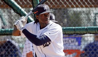 FILE - In this Feb. 27, 2016, file photo, Detroit Tigers&#39; Cameron Maybin takes batting practice during a spring training baseball workout in Lakeland, Fla. Maybin is likely to miss the start of the season because of a broken left wrist. (AP Photo/John Raoux, File)