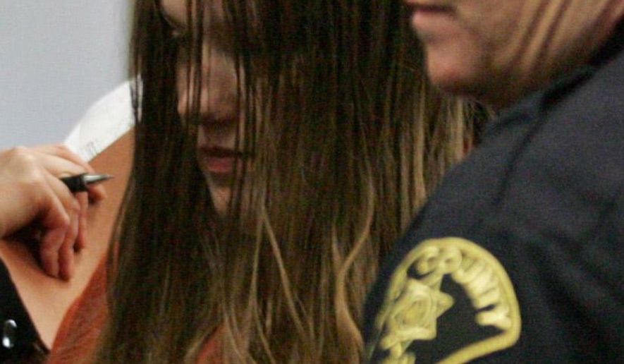 File- This Jan. 8. 2008, file photo shows Michele Anderson, left, who is accused of killing six members of her family on Dec. 24, 2007, in Carnation, Wash. A Seattle jury Friday, March 4, 2016, convicted the 37-year-old woman of killing six members of her family on Christmas Eve 2007 during a holiday gathering. Anderson was found guilty of six counts of first-degree aggravated murder following a five-week trial in King County Superior Court. (Ken Lambert/The Seattle Times via AP)