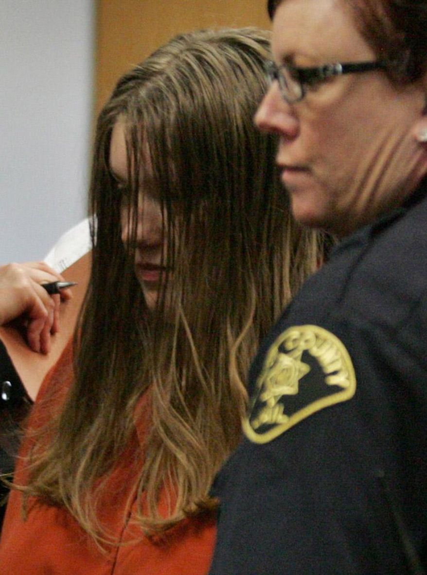 File- This Jan. 8. 2008, file photo shows Michele Anderson, left, who is accused of killing six members of her family on Dec. 24, 2007, in Carnation, Wash. A Seattle jury Friday, March 4, 2016, convicted the 37-year-old woman of killing six members of her family on Christmas Eve 2007 during a holiday gathering. Anderson was found guilty of six counts of first-degree aggravated murder following a five-week trial in King County Superior Court. (Ken Lambert/The Seattle Times via AP)
