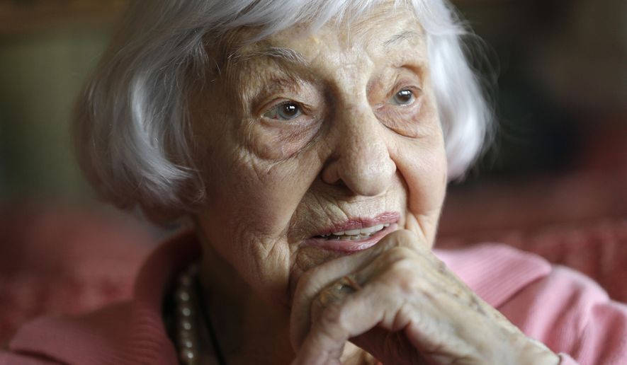 In this Tuesday, March 1, 2016 photo, Amelia Greeley reflects on her time spent as an Army nurse during World War II in the South Pacific, in New York. Greeley, who goes by Mimi, celebrated her 100th birthday this week and will be sharing the milestone with a friend she made nearly 70 years ago during the war. (AP Photo/Julie Jacobson)
