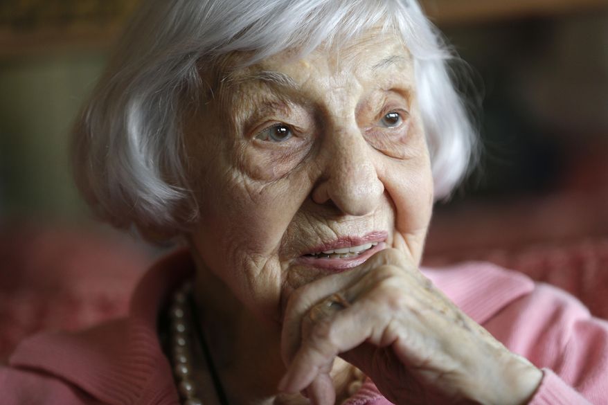 In this Tuesday, March 1, 2016 photo, Amelia Greeley reflects on her time spent as an Army nurse during World War II in the South Pacific, in New York. Greeley, who goes by Mimi, celebrated her 100th birthday this week and will be sharing the milestone with a friend she made nearly 70 years ago during the war. (AP Photo/Julie Jacobson)