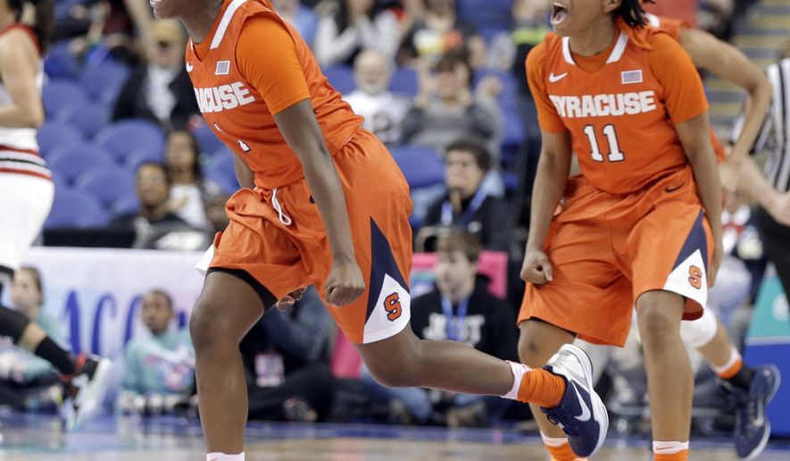 Syracuse&#39;s Alexis Peterson (1) and Cornelia Fondren (11) celebrate after an NCAA college basketball game against Louisville in the Atlantic Coast Conference tournament in Greensboro, N.C., Saturday, March 5, 2016. Syracuse won 80-75. (AP Photo/Chuck Burton)