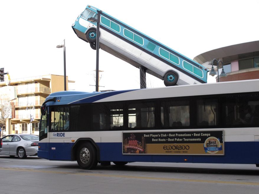 A city bus passes the sculpture in front of the bus station in downtown Reno, Nevada on Wednesday, March 2, 2016. Washoe County's Regional Transportation Commission and the union representing its bus drivers are locked in a 2-year-old legal battle over whether expanding the audio reach of the bus surveillance recordings amounts to illegal eavesdropping on passengers. (AP Photo/Scott Sonner).