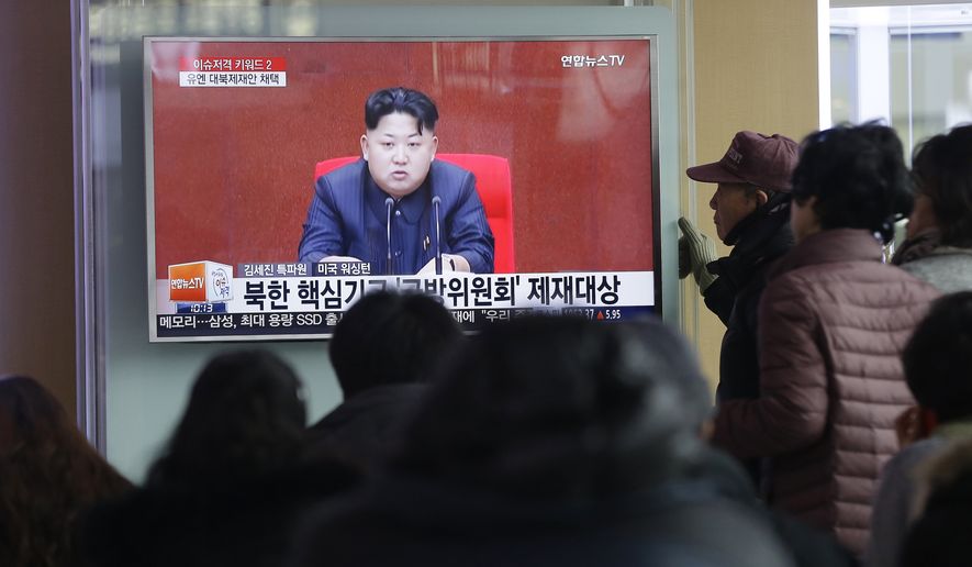 People watch a TV news program showing North Korean leader Kim Jong-un at Seoul Railway Station on March 3. (Associated Press)