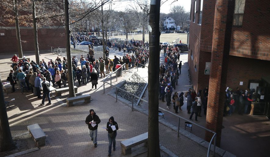 Voters, some of whom waited more than five hours, stand in line that stretched well over one half-mile long to get into a Democratic caucus location at Deering High School, Sunday, March 6, 2016, in Portland, Maine. Several thousand voters showed up to choose between Democratic presidential candidates Hillary Clinton and Bernie Sanders, who're vying to represent the party in the general election. (AP Photo/Robert F. Bukaty)