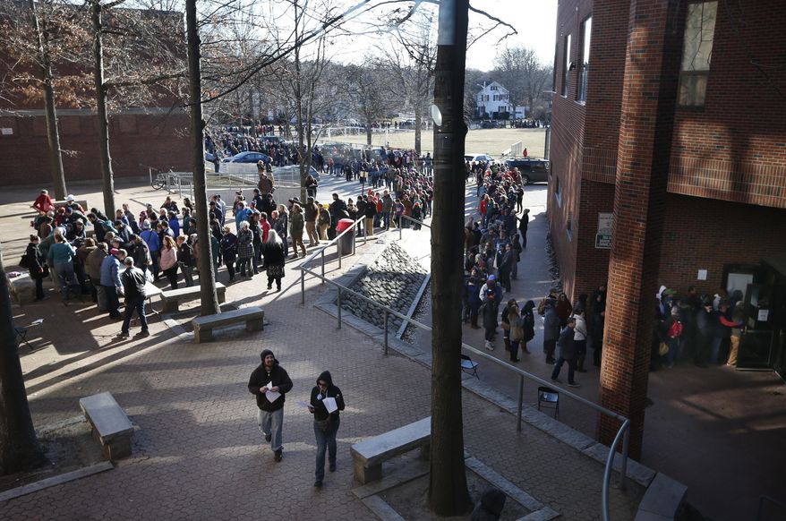 Voters, some of whom waited more than five hours, stand in line that stretched well over one half-mile long to get into a Democratic caucus location at Deering High School, Sunday, March 6, 2016, in Portland, Maine. Several thousand voters showed up to choose between Democratic presidential candidates Hillary Clinton and Bernie Sanders, who're vying to represent the party in the general election. (AP Photo/Robert F. Bukaty)