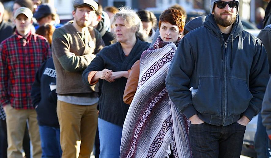 Voters wait to enter a primary polling center in Maine earlier this year.  (AP Photo/Robert F. Bukaty)