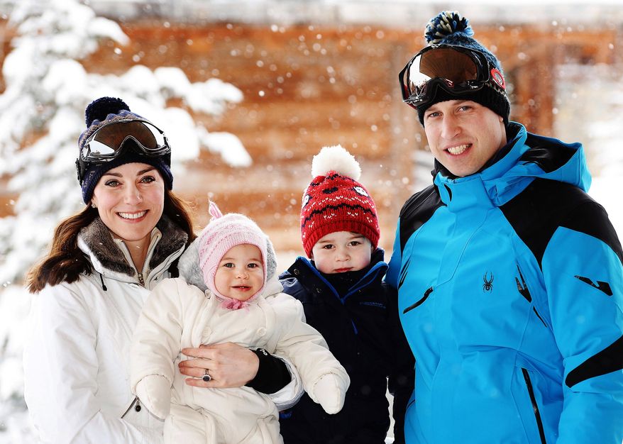 Britain's Prince William, right, and Duchess of Cambridge with their children, Princess Charlotte, center left, and Prince George, enjoy a short private break skiing in the French Alps, Thursday March 3, 2016. This is the first time the family of four have taken a holiday together. (John Stillwell/Pool via AP)