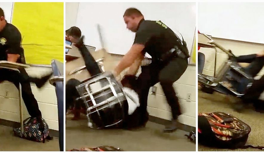 A deputy forcibly removes a student from her chair after she refused to leave her high school math class, in Columbia, South Carolina last fall. Tough-on-crime policies of the 1990s and the advent of mass shootings at schools led to more and more schools districts assigning full-time, armed officers to patrol the hallways and grounds. (Associated Press)