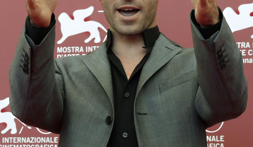FILE - In this Aug. 30, 2013 file photo, actor James Deen poses at photo call for the film "The Canyons" at the Venice Film Festival in Venice, Italy. California has cited a movie company owned by porn star Deen, whose real name is Bryan Sevilla, for failing to use condoms on a film shoot, potentially exposing actors to hepatitis B and HIV. The state Division of Occupational Safety and Health (Cal/OSHA) on Wednesday, March 9, 2016 cited Los Angeles-based Third Rock Productions for nine violations, some considered serious, and proposed nearly $78,000 in fines. (AP Photo/David Azia, File)