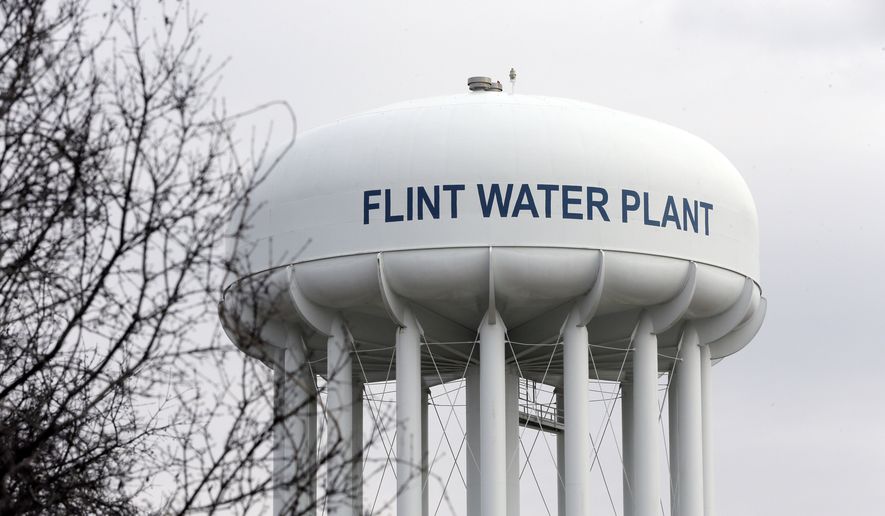 The Flint Water Plant tower is seen in Flint, Mich. (AP Photo/Carlos Osorio, FILE)