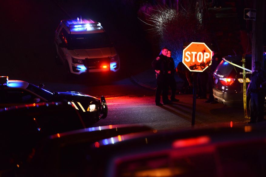Police investigate the scene after a shooting on Wednesday, March 9, 2016, in Wilkinsburg, Pa. Police say five people have been killed in a shooting in suburban Pittsburgh and at least two gunmen are at large. Allegheny County police say four women and a man were killed late Wednesday during a backyard party in the Borough of Wilkinsburg. At least three others are in stable or critical condition at hospitals. (Michael Henninger/Pittsburgh Post-Gazette via AP) MANDATORY CREDIT