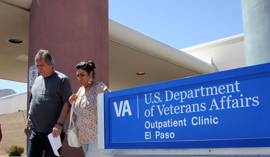 A couple exits the Veterans Affairs facility in El Paso, Texas, on June 9, 2014. (Associated Press) **FILE**