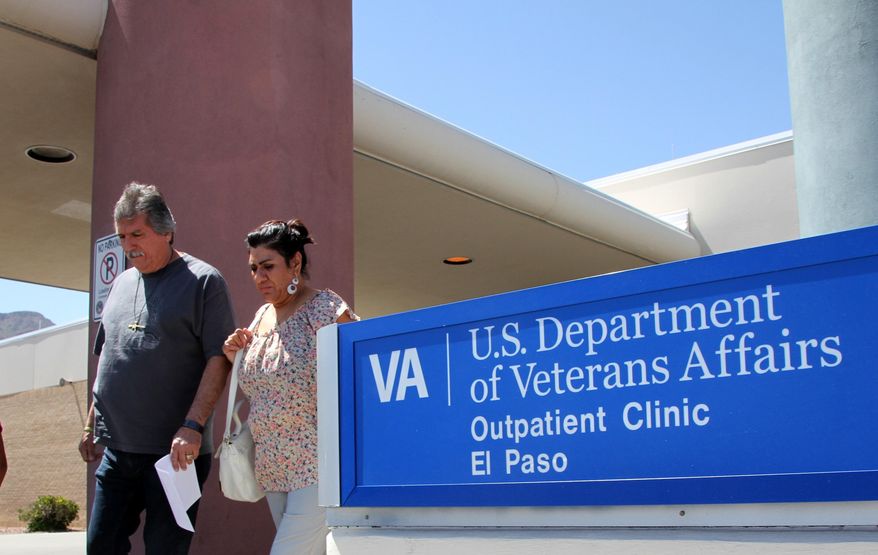 A couple exits the Veterans Affairs facility in El Paso, Texas, on June 9, 2014. (Associated Press) **FILE**