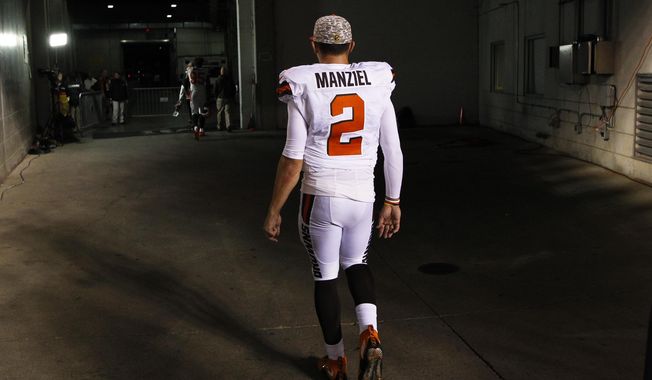 FILE - In this Nov. 5, 2015, file photo, Cleveland Browns quarterback Johnny Manziel walks off the field after an 31-10 loss to the Cincinnati Bengals, in Cincinnati. The Browns have released troublesome quarterback Johnny Manziel. The team cut ties on Friday, March 11, 2016,  with the 2012 Heisman Trophy winner after two disappointing, drama-filled seasons. (AP Photo/Frank Victores, File)