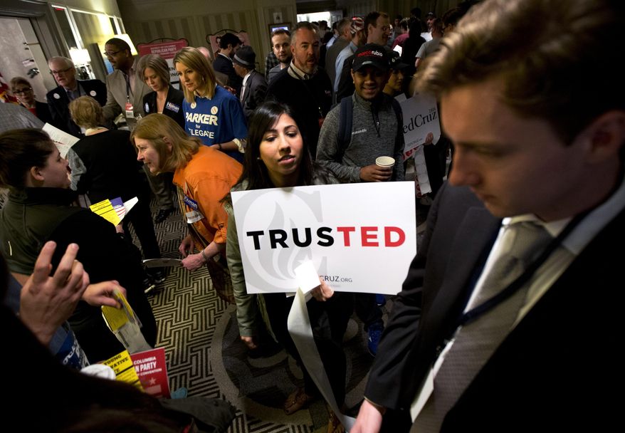 Vinca Puri makes her choice known carrying a placard in support of Republican presidential candidate Sen. Ted Cruz, R-Texas, during the GOP caucus in Washington, Saturday, March 12, 2016. Washington Republicans are voting for 16 allocated delegates to the Republican National Convention. (AP Photo/Manuel Balce Ceneta)