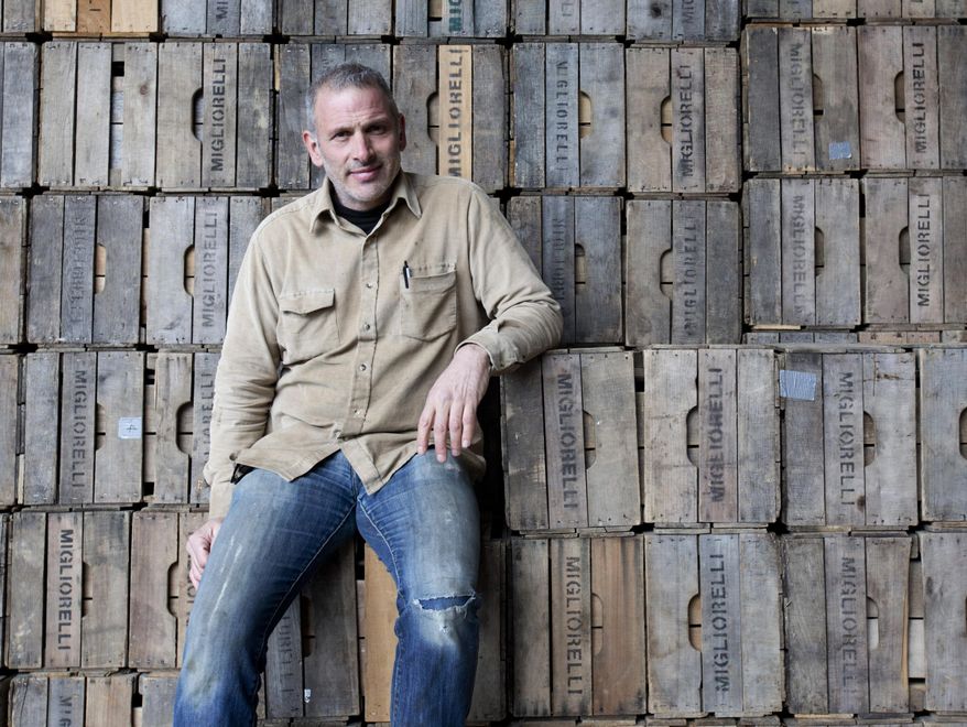 In this March 2, 2016 photo, farmer Ken Migliorelli poses at his family farm in Red Hook, N.Y. While fast-food workers and others in low wage jobs have been the focus of a campaign to raise minimum wages, farm workers in New York generally make more than the state minimum already, according to an agriculture lending institution. (AP Photo/Mike Groll)