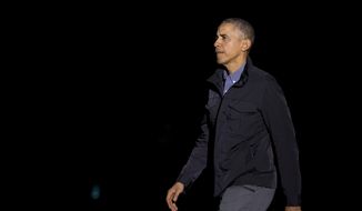 President Barack Obama walks on the South Lawn of the White House in Washington, Saturday, March 12, 2016, upon arrival from a trip to Dallas, Texas.  (AP Photo/Manuel Balce Ceneta)