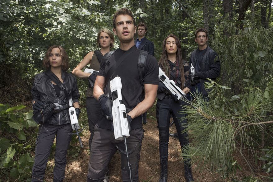 This image released by Lionsgate shows from left, Zoe Kravitz, Shailene Woodley, Theo James, Ansel Elgort, Maggie Q and Miles Teller in a scene from "The Divergent Series: Allegiant." (Murray Close/Lionsgate via AP)