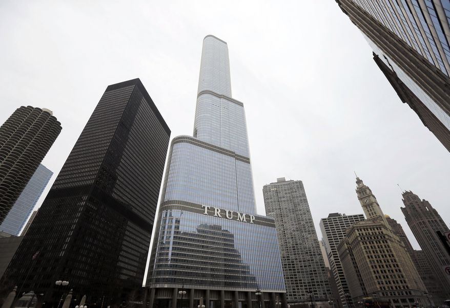 In this Thursday, March 10, 2016, photo is the Trump International Hotel and Tower in Chicago. Republican presidential candidate Donald Trump has pledged to scrap a work visa program that brings 300,000 student workers each year to the U.S. Among the businesses that would be forced to stop hiring foreign labor: Trump's own. (AP Photo/Charles Rex Arbogast)