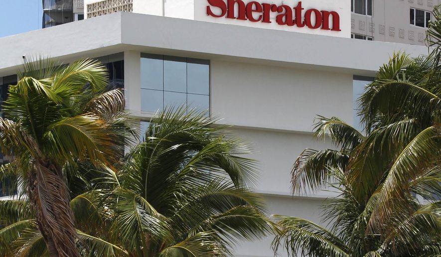 FILE - This July 25, 2011, file photo, shows the Sheraton Fort Lauderdale Beach Hotel, a member of the Starwood Hotels and Resorts group, in Fort Lauderdale, Fla. A fight for control of the Starwood hotel chain is under way after a buyout offer from a consortium led by China’s Anbang Insurance Group. Starwood Hotels & Resorts Worldwide Inc. said Monday, March 14, 2016, that it still favors the bid from Marriott, but that it’s looking at the latest bid. (AP Photo/Wilfredo Lee, File)