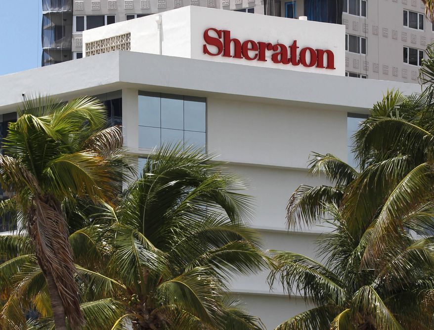 FILE - This July 25, 2011, file photo, shows the Sheraton Fort Lauderdale Beach Hotel, a member of the Starwood Hotels and Resorts group, in Fort Lauderdale, Fla. A fight for control of the Starwood hotel chain is under way after a buyout offer from a consortium led by China’s Anbang Insurance Group. Starwood Hotels & Resorts Worldwide Inc. said Monday, March 14, 2016, that it still favors the bid from Marriott, but that it’s looking at the latest bid. (AP Photo/Wilfredo Lee, File)