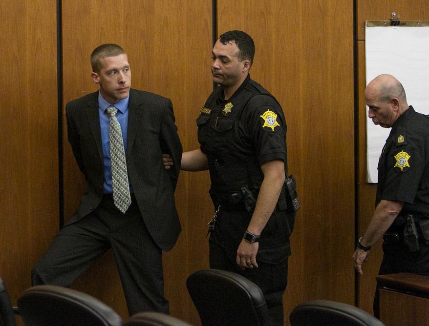 Ex-Trooper Sean Groubert, left, looks back at his wife as he is taken into custody after he pleaded guilty Monday, March 14, 2016, to the charge of assault and battery of high and aggravated nature for the 2014 shooting ofLevar Jones during a traffic stop. Groubert will be sentenced later. He faces up to 20 years for assault and battery of a high and aggravated nature. There is no minimum sentence. (Tim Dominick/The State via AP) ALL LOCAL MEDIA OUT, (TV, ONLINE, PRINT); MANDATORY CREDIT